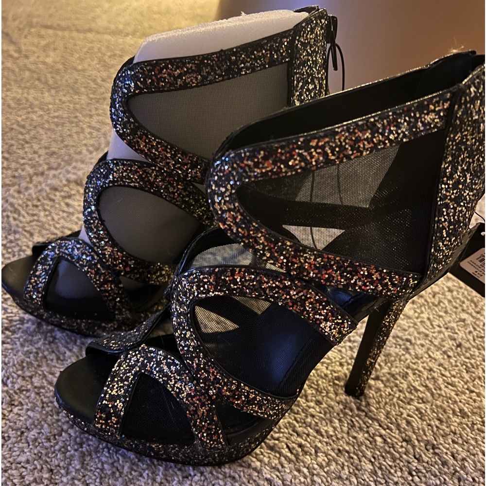 Perfect shoe for NYE!  Brand new! Express heels with zip up back. Size 6 1/2.